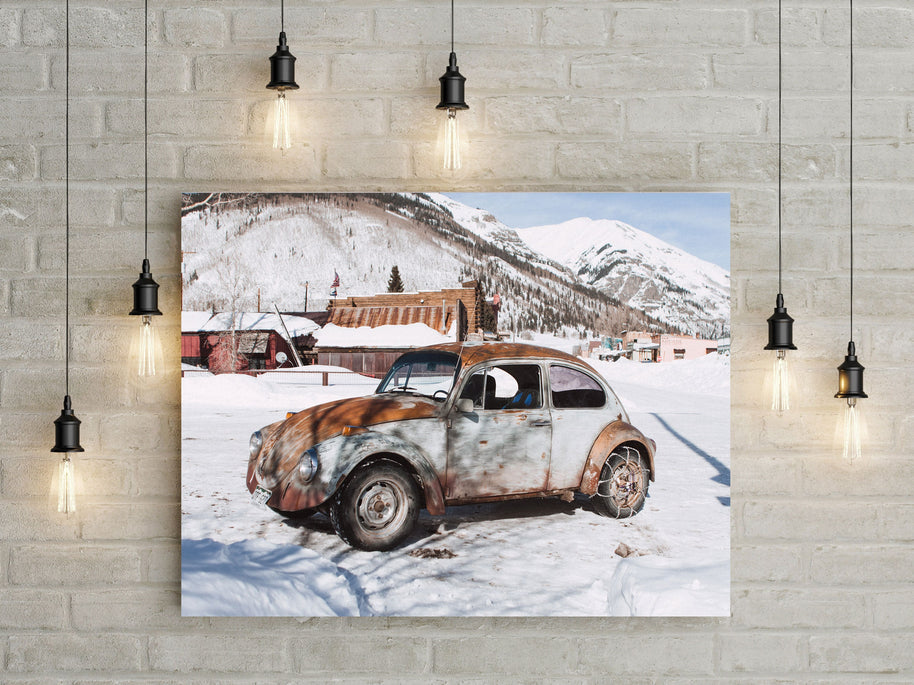 Winter Wonderland Beauty: Scenic Photo of Vintage Beetle in a Quaint Snowy Mountain Village
