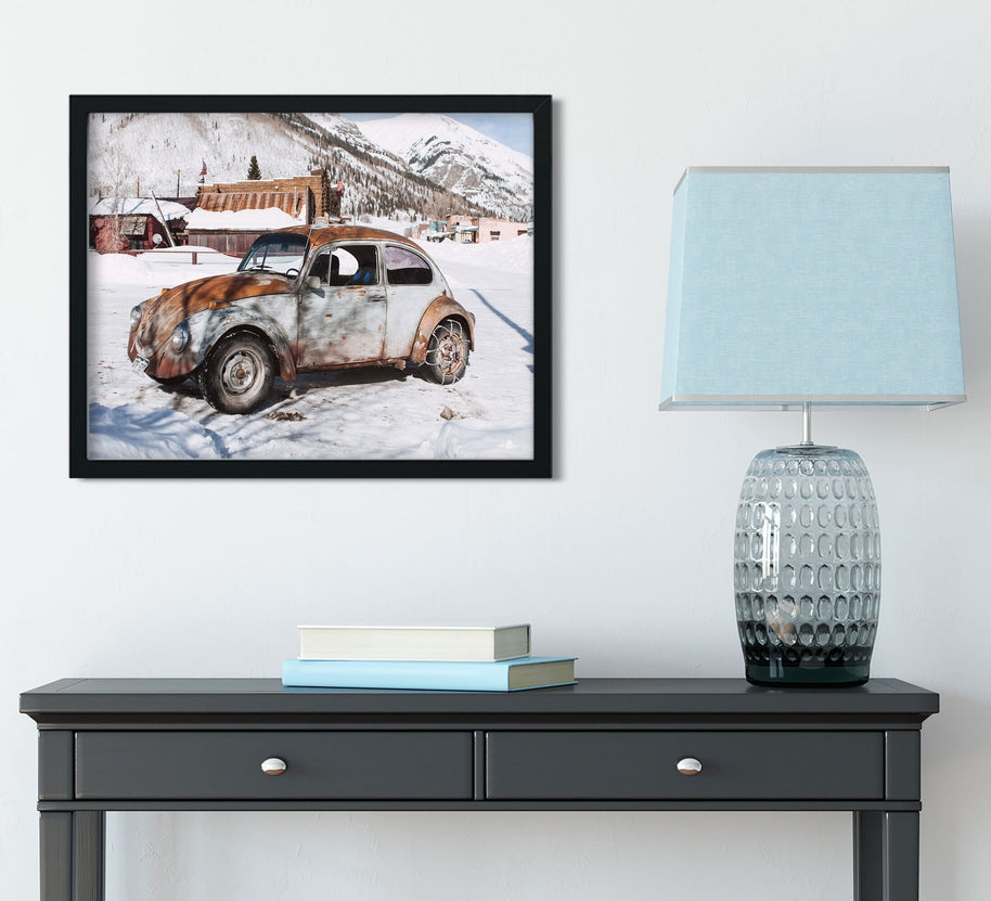 Winter Wonderland Beauty: Scenic Photo of Vintage Beetle in a Quaint Snowy Mountain Village