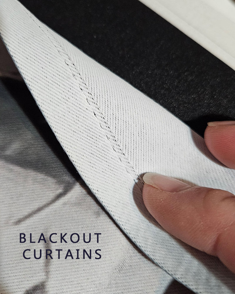 Close-up of a fabric curtain panel with a visible fold seam and a finger pointing to it, with the text 'BLACKOUT CURTAINS' overlaid in the lower left.