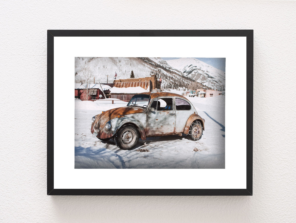 Winter Wonderland Beauty: Scenic Photo of Vintage Beetle in a Quaint Snowy Mountain Village