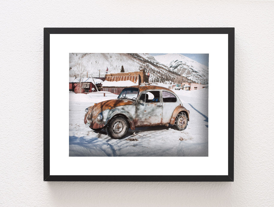 Winter Wonderland Beauty: Scenic Photo of Vintage Beetle in a Quaint Snowy Mountain Village