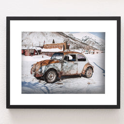 Winter Wonderland Beauty: Scenic Photo of Vintage Beetle in a Quaint Snowy Mountain Village