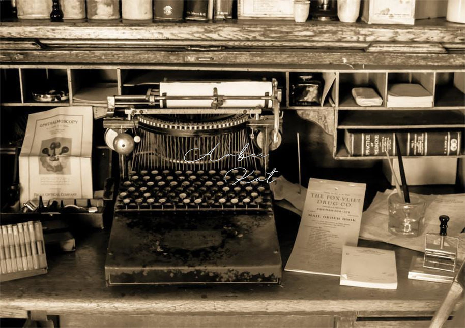 Vintage typewriter with worn metal body and black keys on old wooden desk in 19th century apothecary office south park