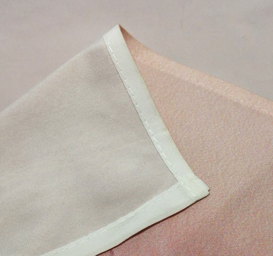 Details of a wall tapestry with hemmed stitching on microfiber fabric