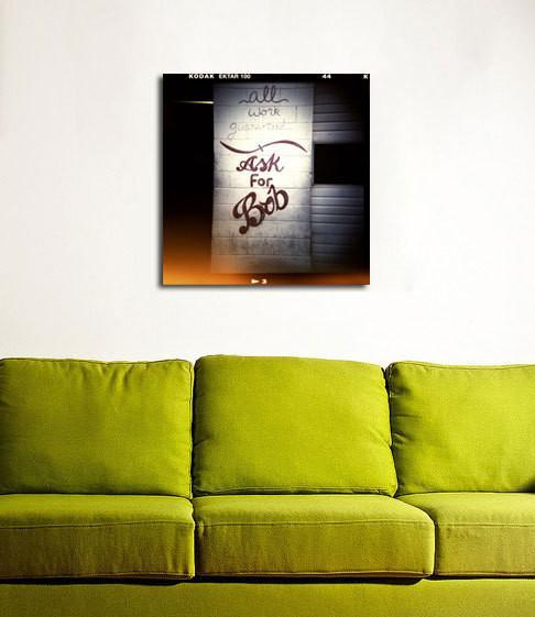 Black and white bob retro photo print of graffiti wall ask for bob above lime green sofa shop holga photography