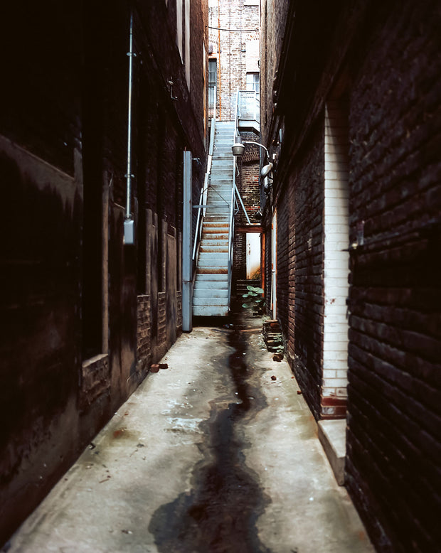 A weathered light blue metal staircase with rust and peeling paint in grunge alley birmingham alabama photo print