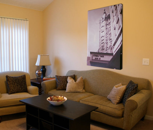 A canvas print hanging on a wall in a home